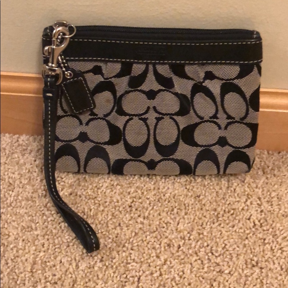 Small gray and white coach wristlet